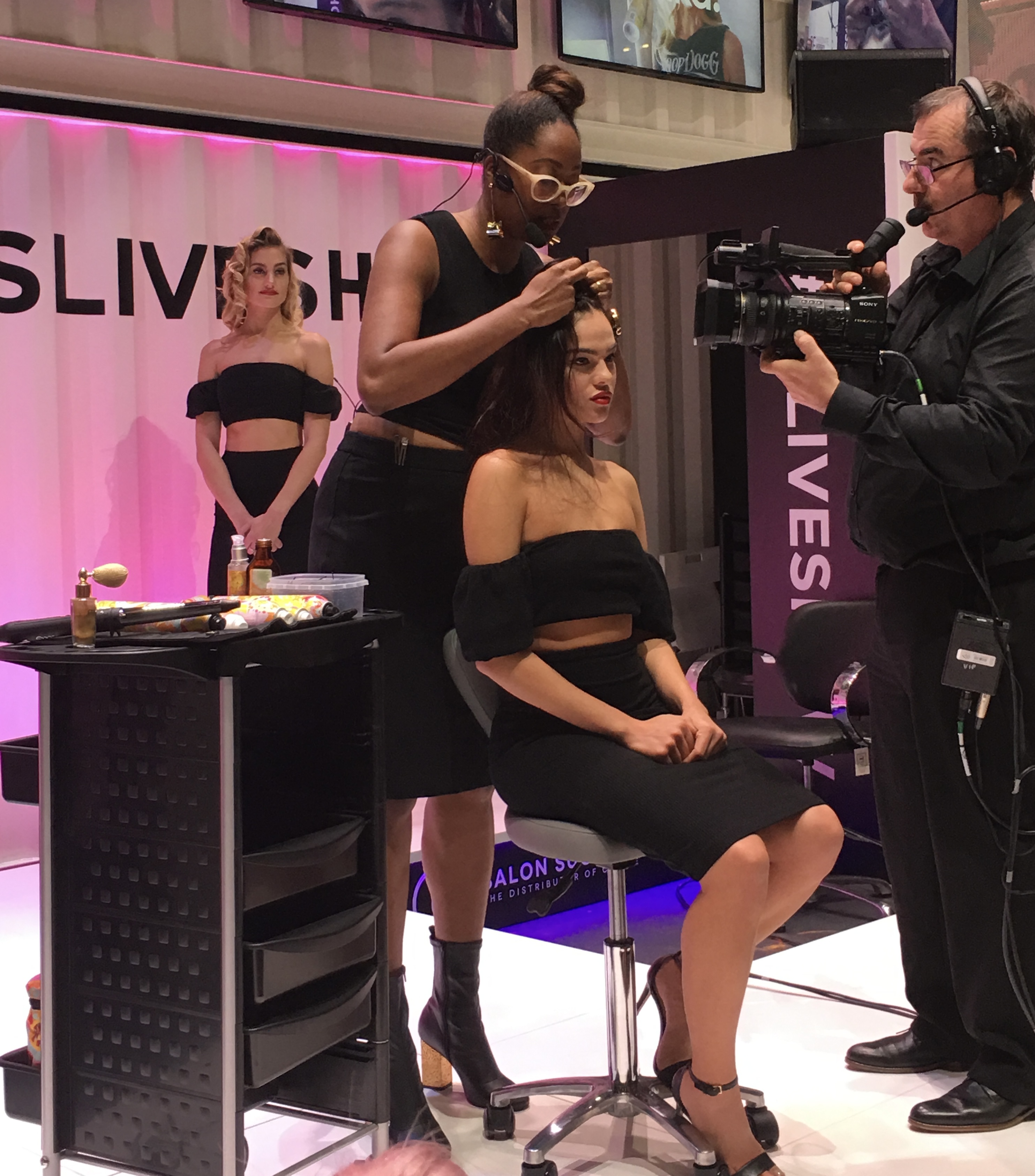Ciara styling live on stage at a beauty trade show