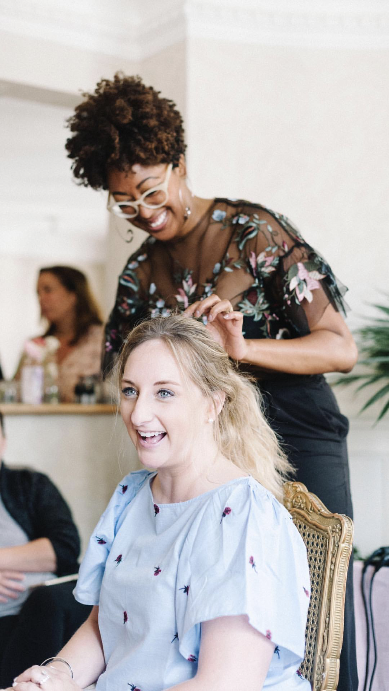 Ciara styling a client during a hands-on workshop session