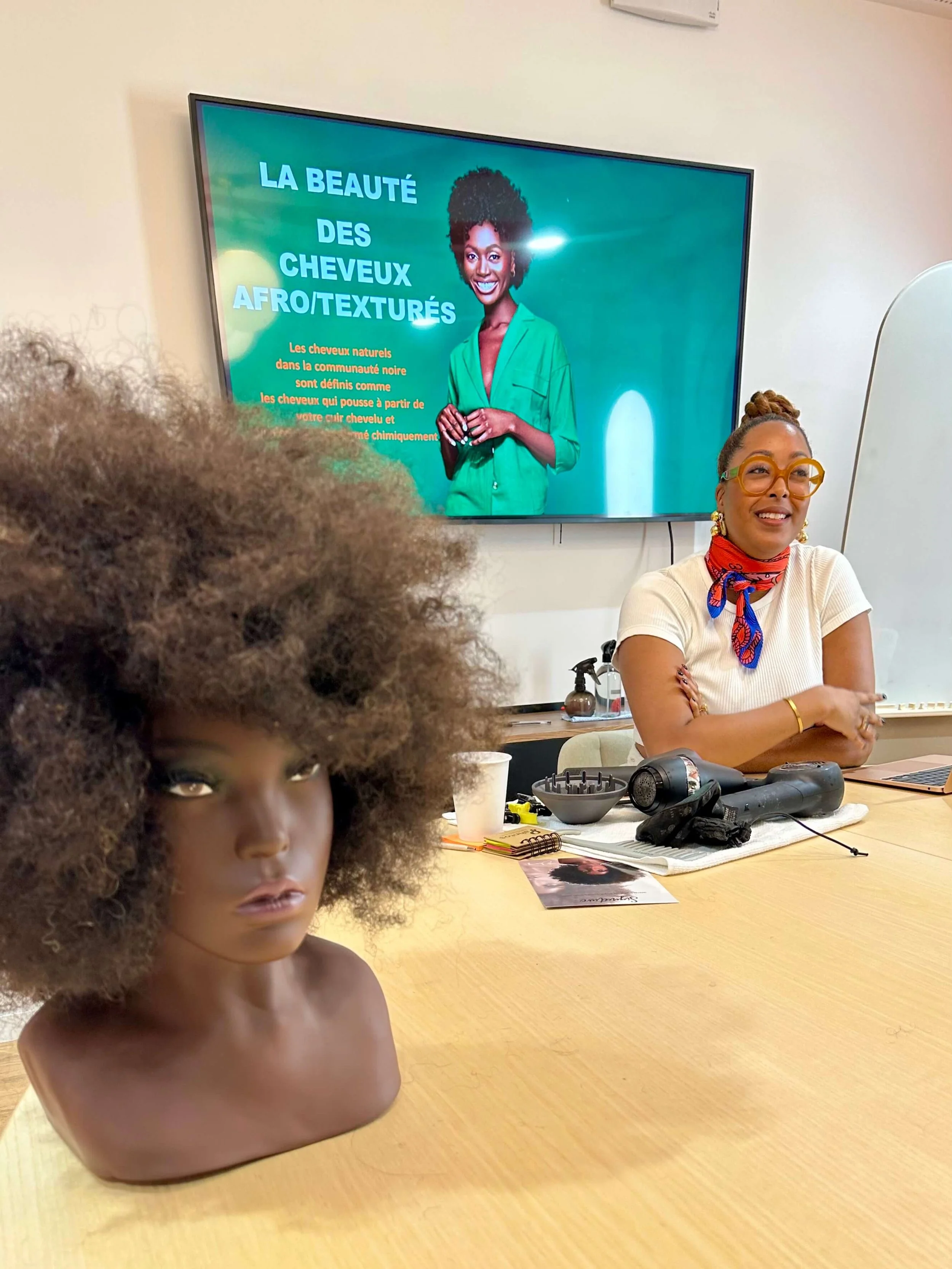 Ciara teaching a class on Afro-textured hair care and styling